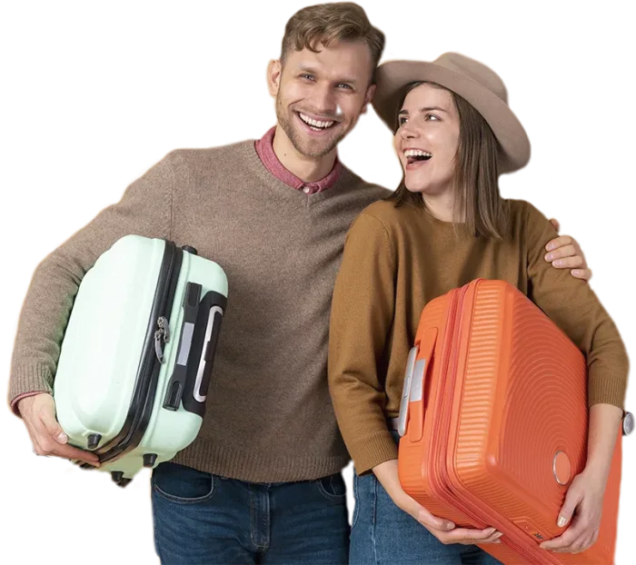 Happy travellers with suitcases ready for their trip